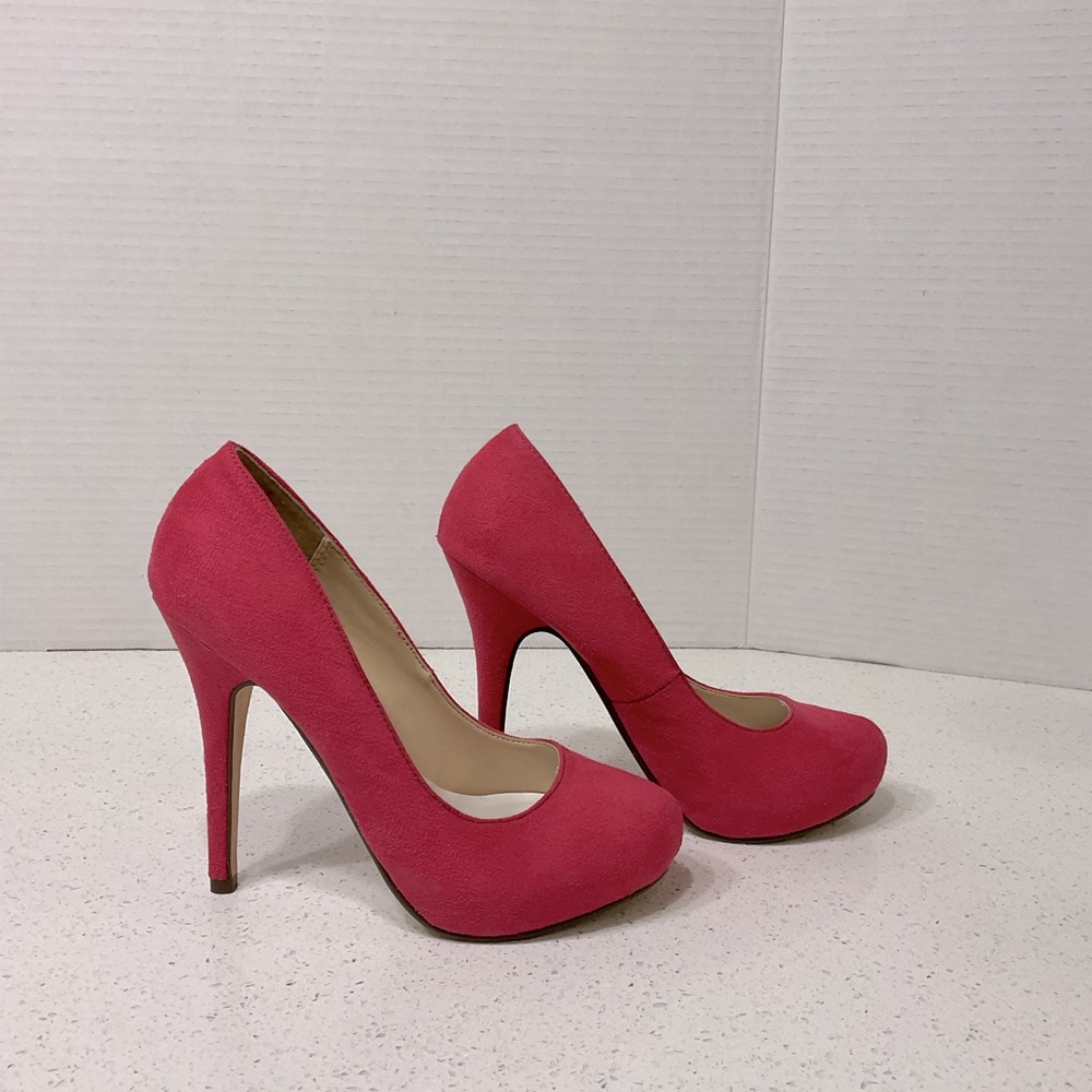 Michael Antonio Pink suede pumps.
